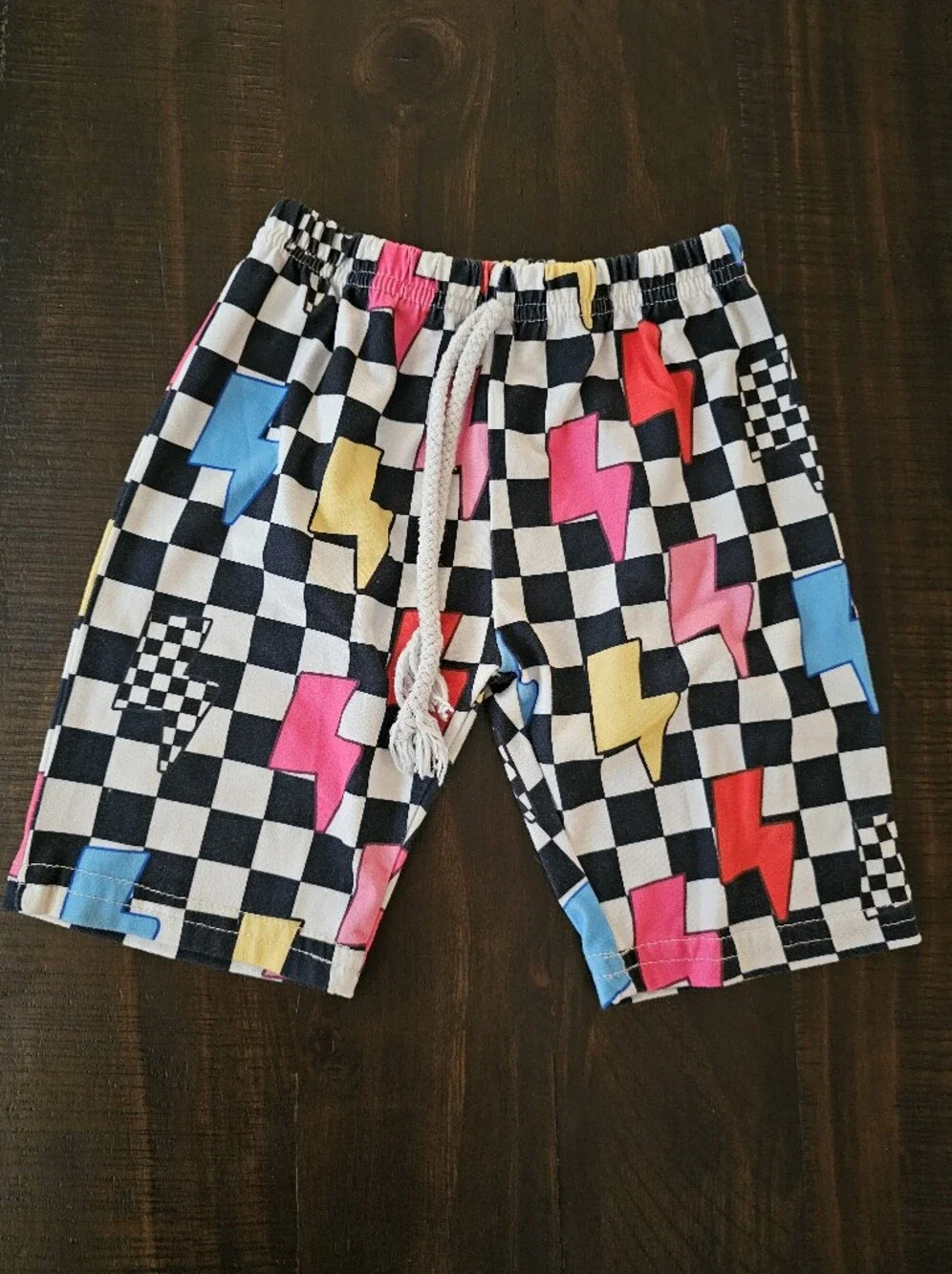 Kids Black Checkered Pajama Shorts with Pink, Blue & Yellow Lightning Bolts